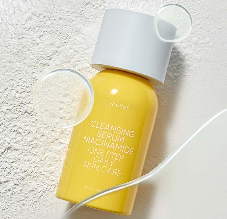 Youlief Cleansing Serum Niacinamide — yellow bottle styled on plaster
